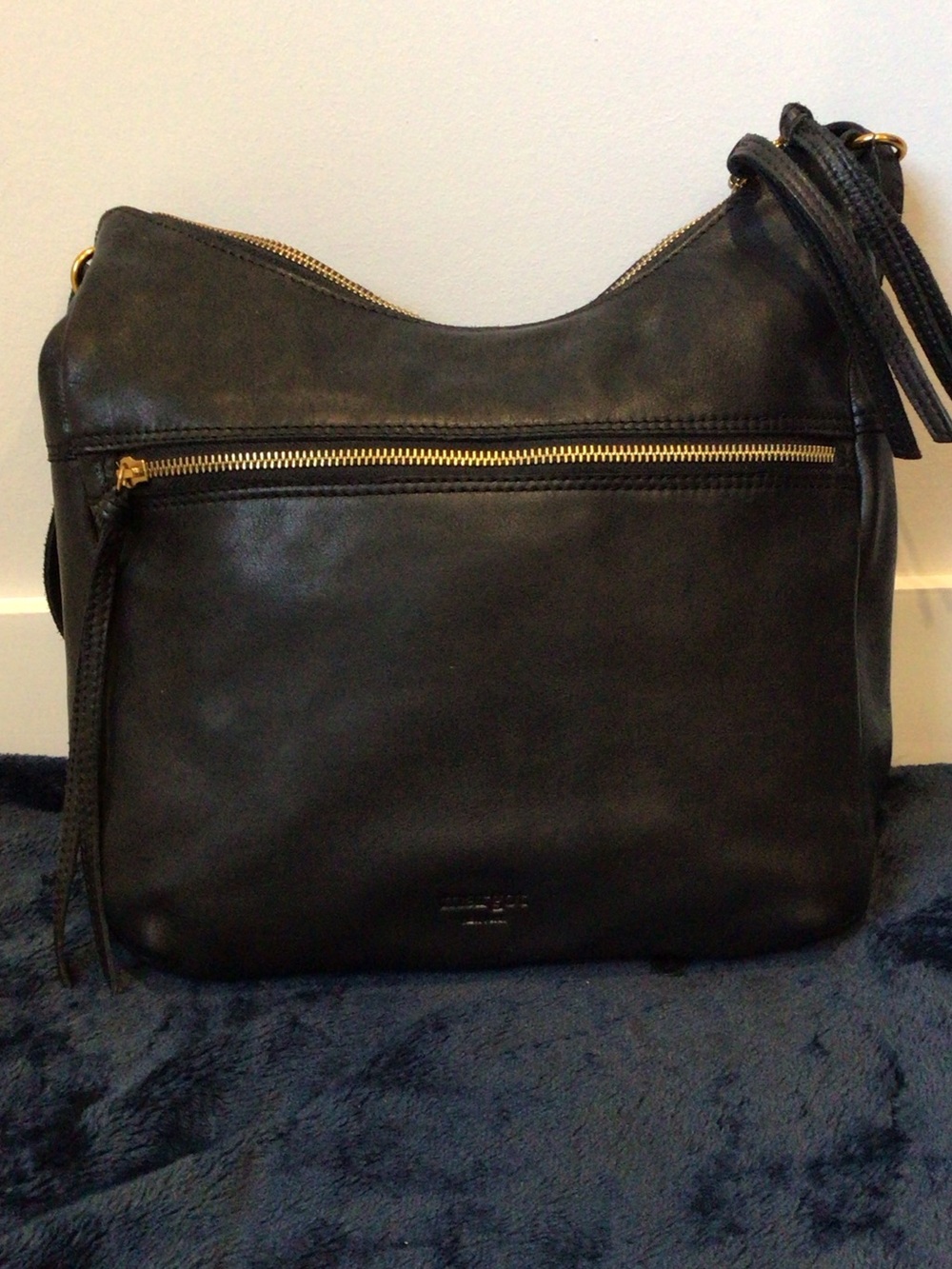 Classic Black Leather Shoulder Bag with Gold Zip Accents